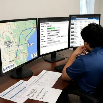 Logistics team monitoring chemical tanker shipment