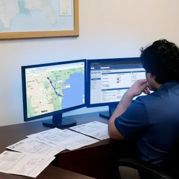 Cross-border freight planning team tracking a shipment
