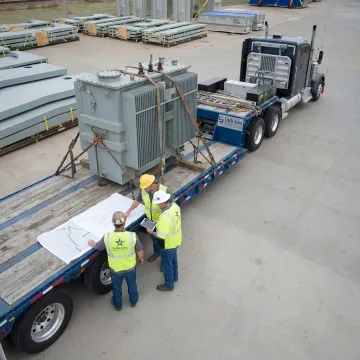 Heavy-haul logistics team planning energy equipment transport