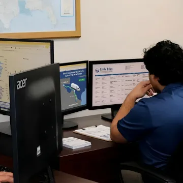 Freight coordinator tracking a white glove shipment