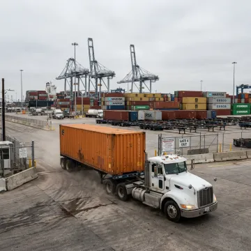 Port drayage truck moving a shipping container