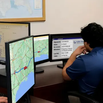 Logistics dispatcher tracking dry van freight