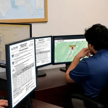 Logistics team planning a flatbed freight route