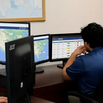 Dispatcher tracking urgent freight shipment