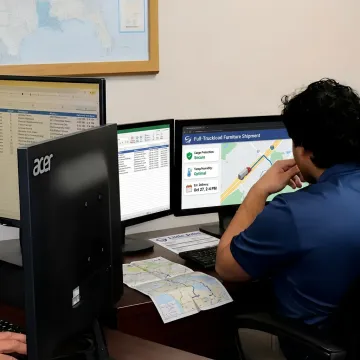 Logistics specialist tracking furniture delivery