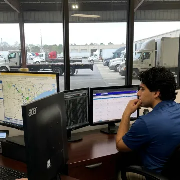 Expedited freight dispatcher tracking urgent shipments