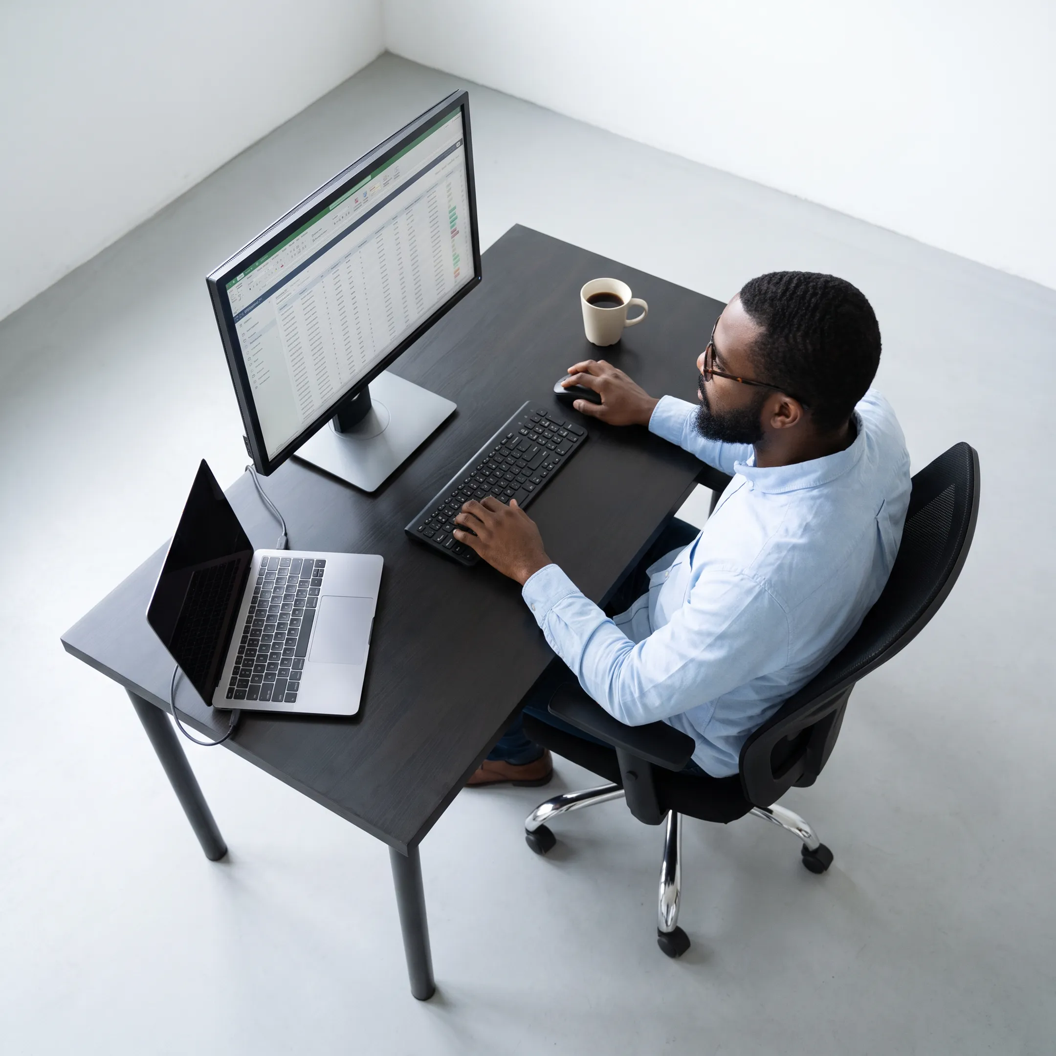 IT specialist monitoring a business firewall security dashboard