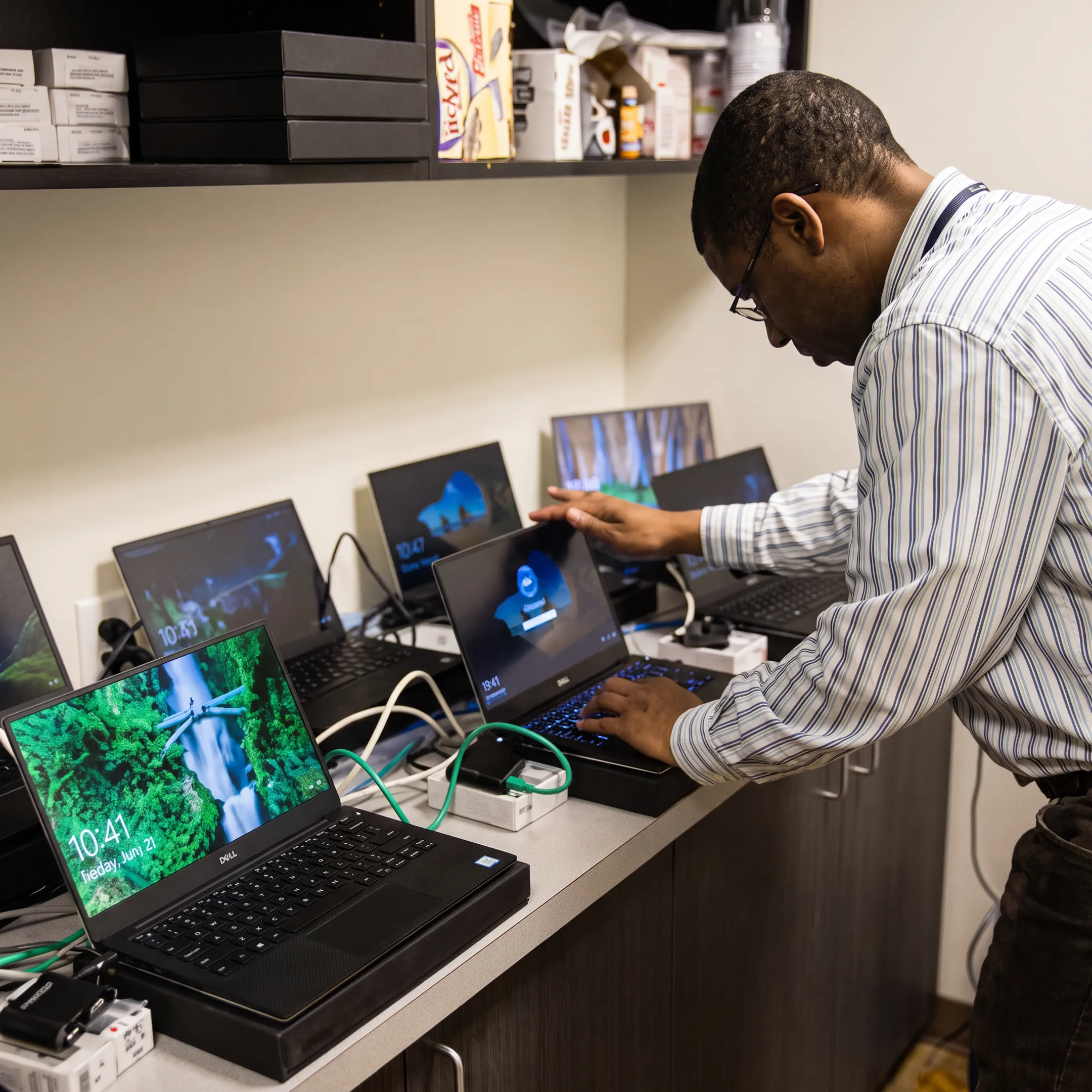 Technician reviewing business network infrastructure