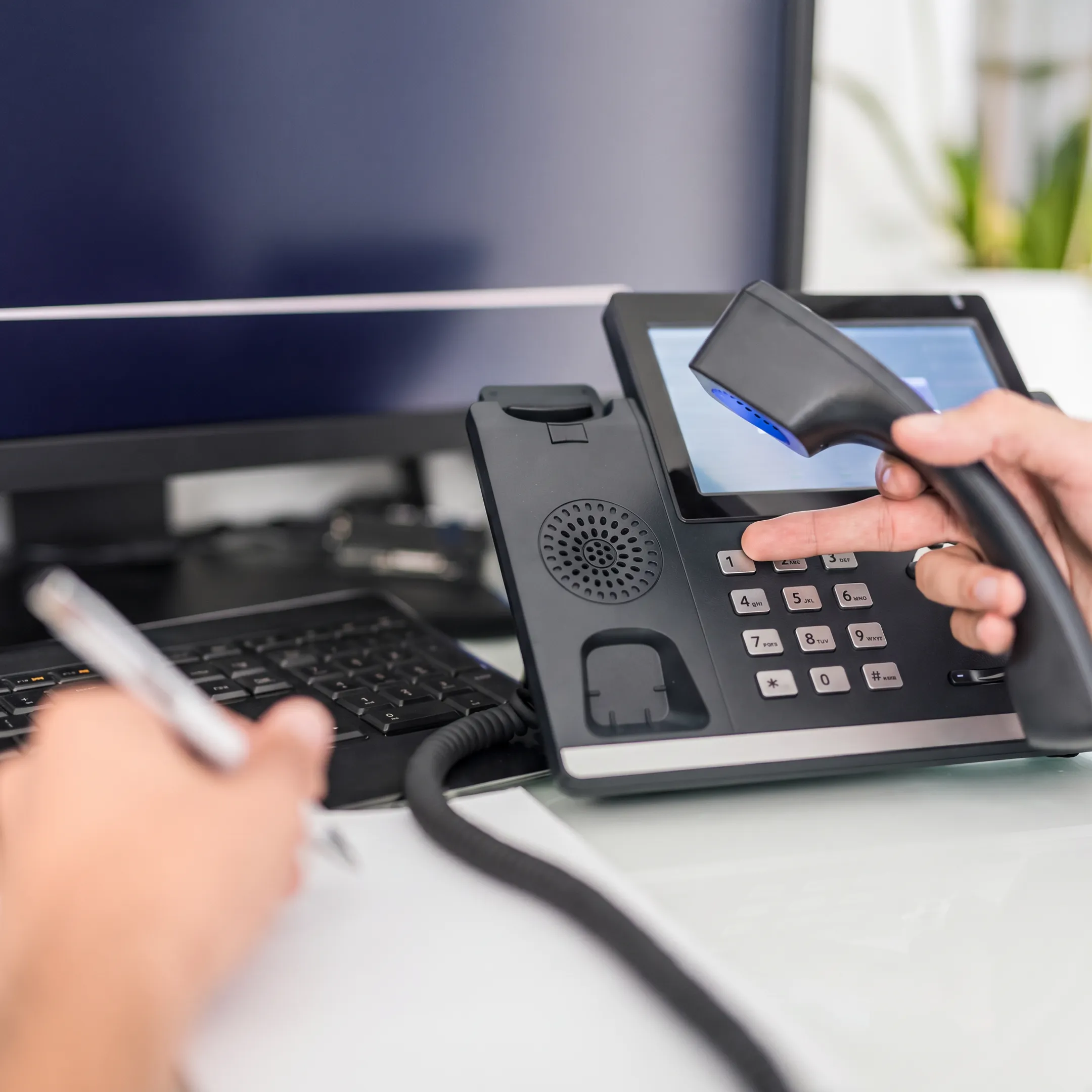 Small business team using a modern VoIP phone system