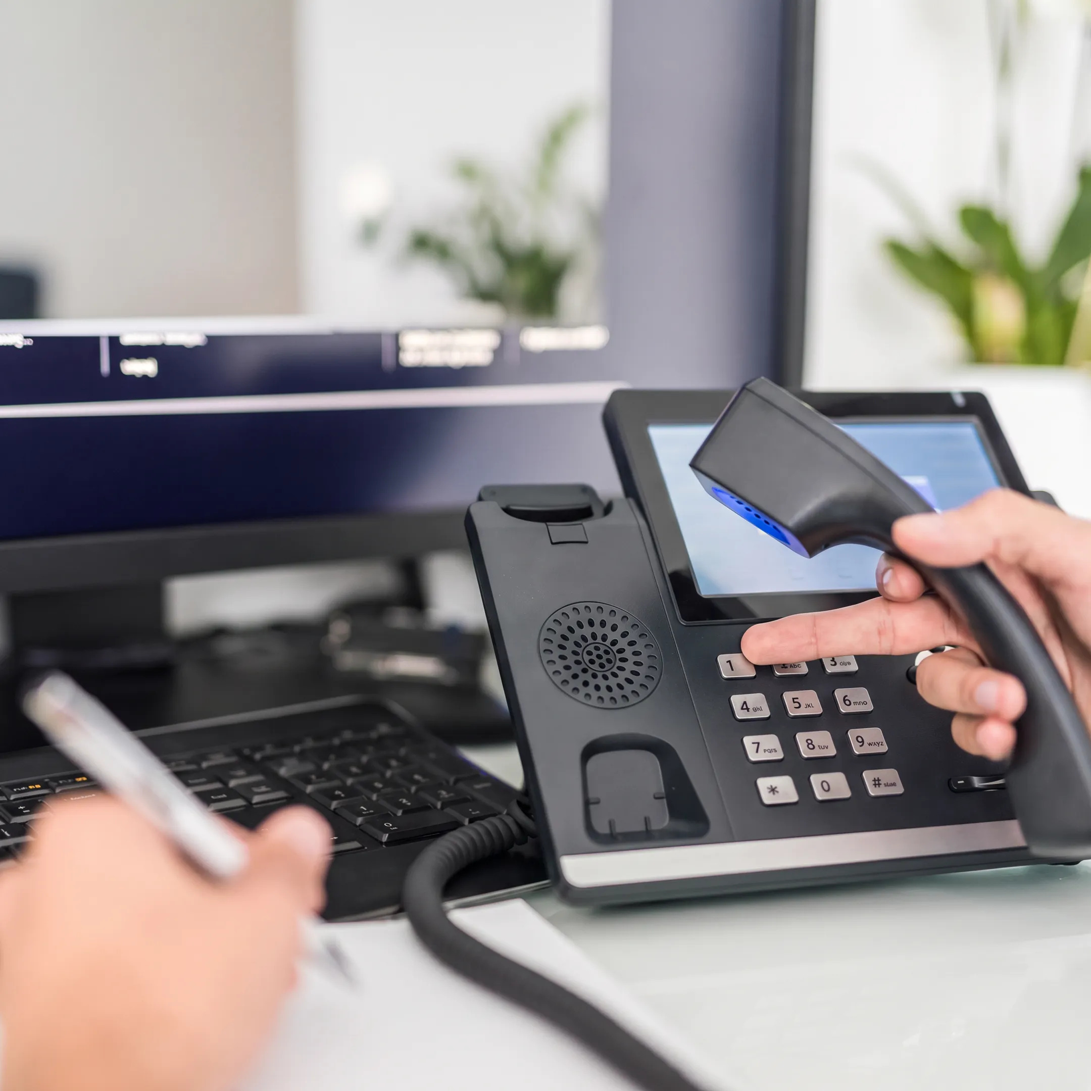 Technician configuring business VoIP equipment