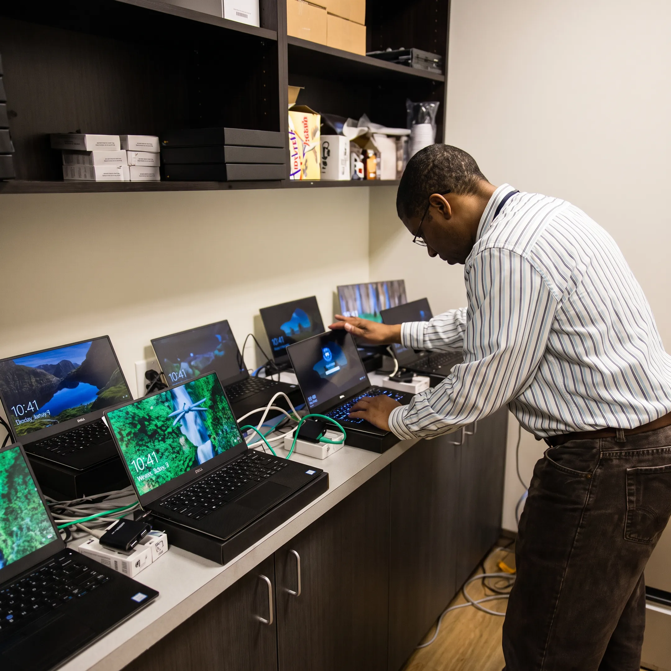 Technician configuring business network and cloud technology