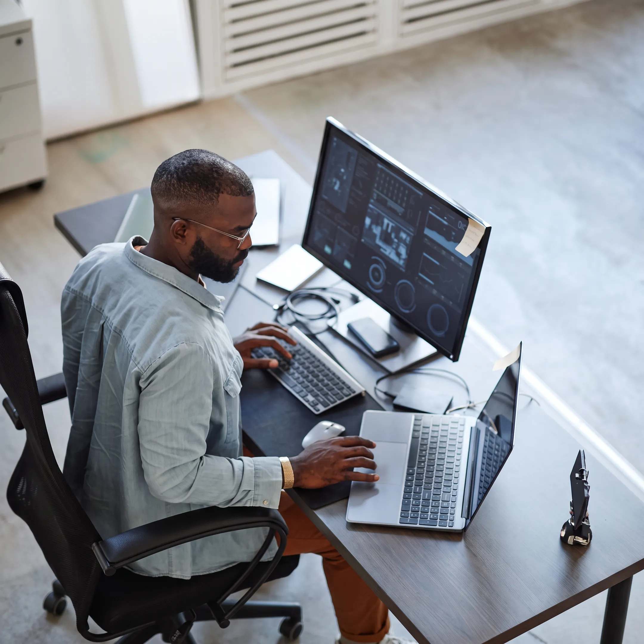 Cybersecurity specialists monitoring business systems and security alerts