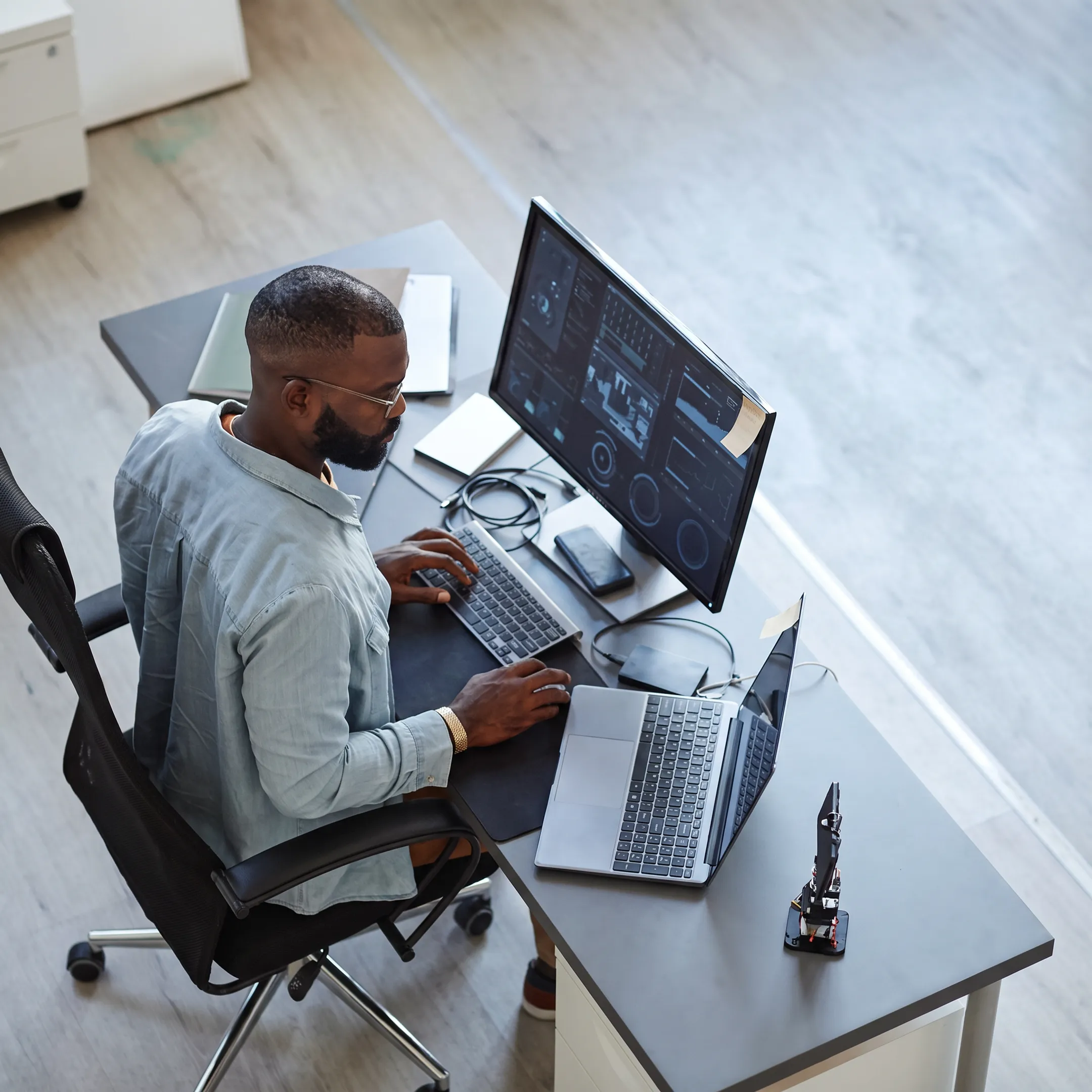 Technician reviewing cybersecurity controls with a business client