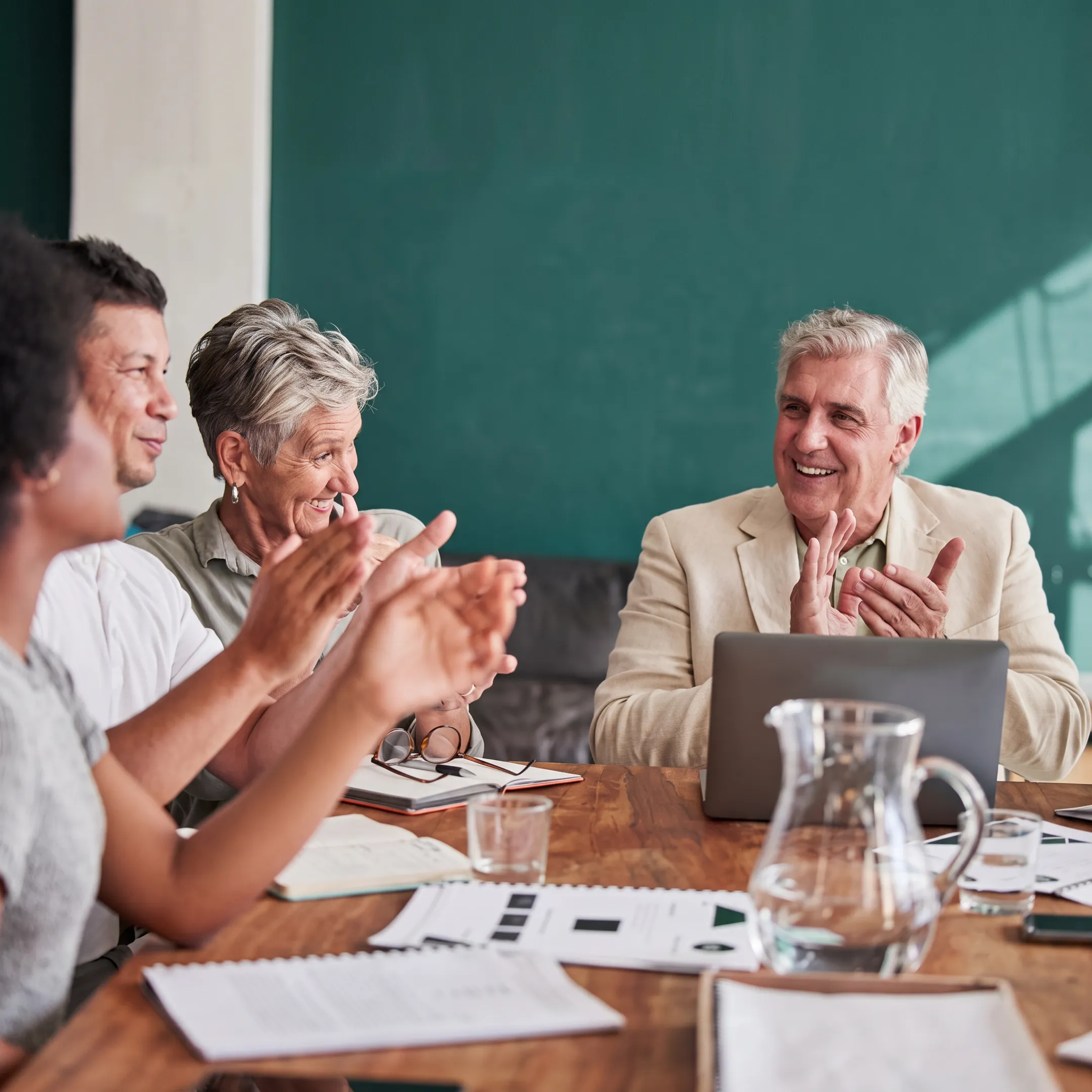Consultant reviewing an ISO 9001 quality management plan with business leaders