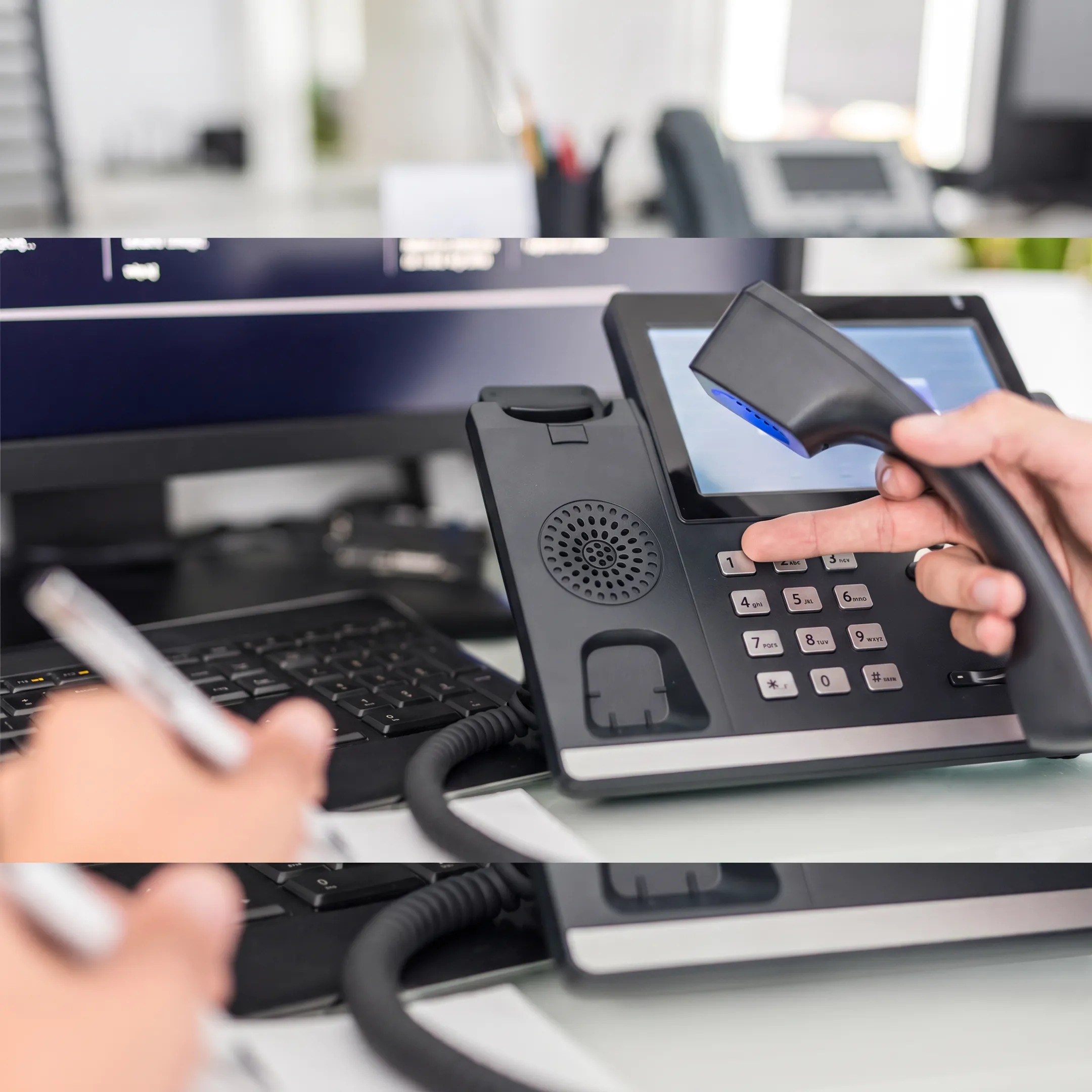 Technician configuring VoIP phones in a small business office