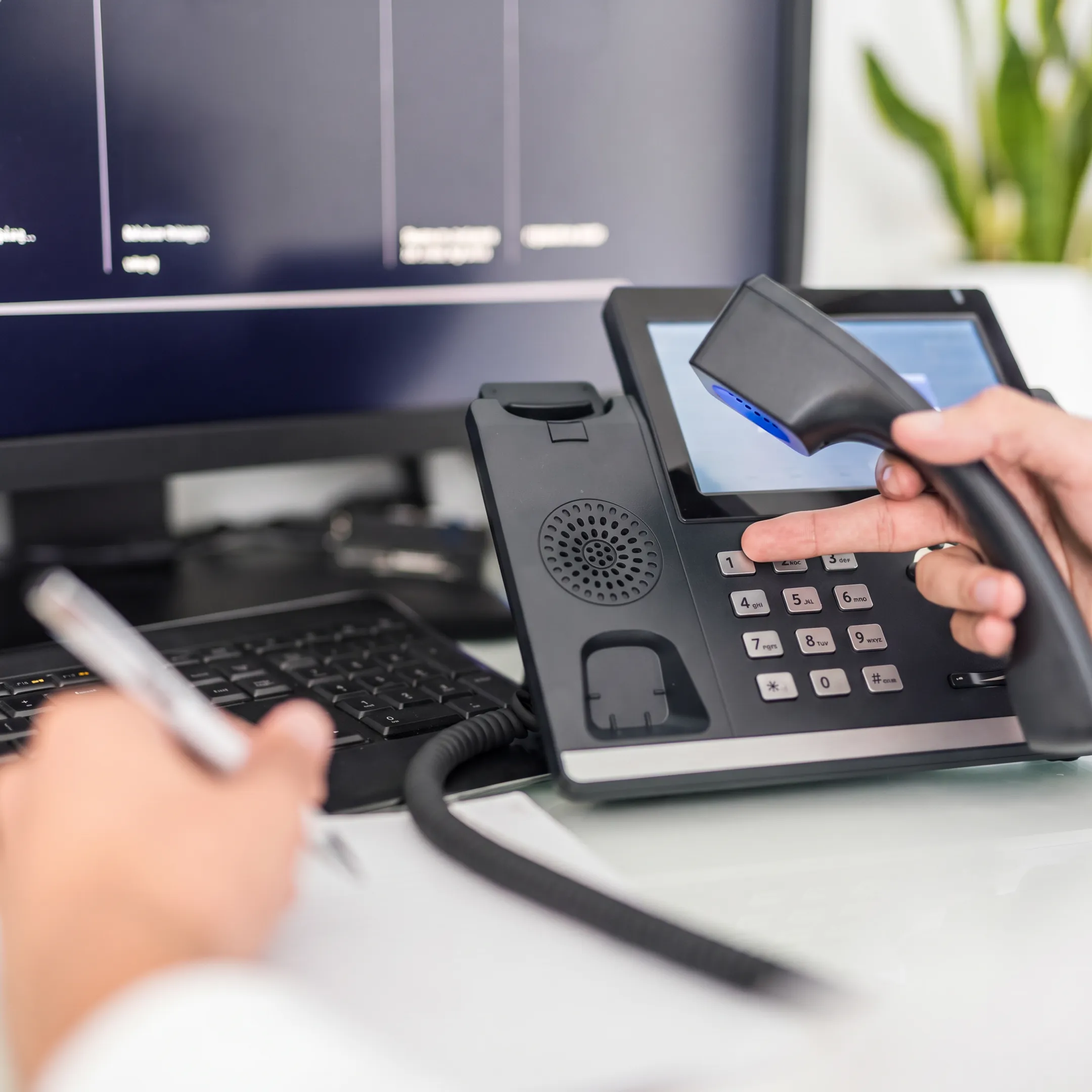 Small business team using a modern VoIP phone system