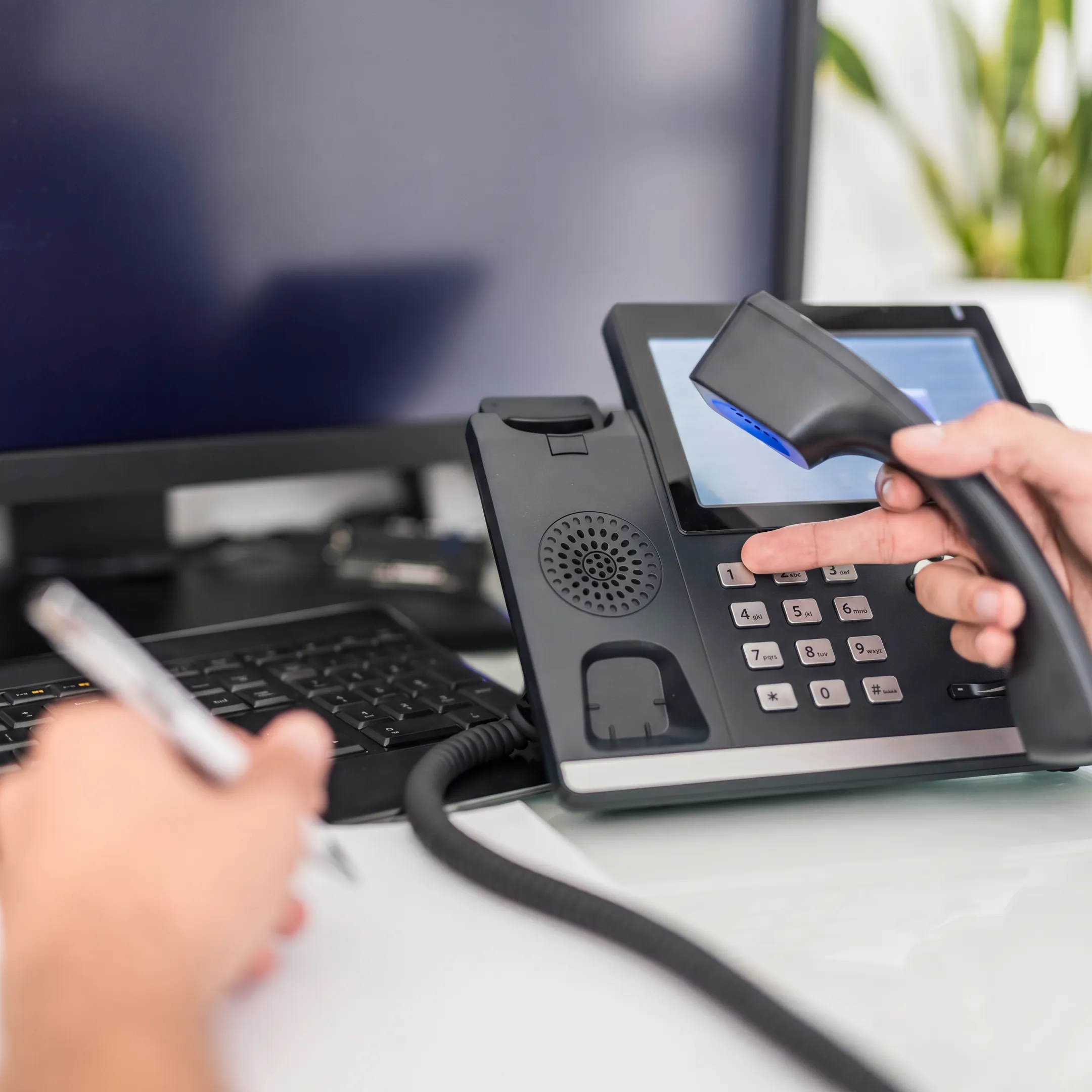 Technician installing a modern business phone system