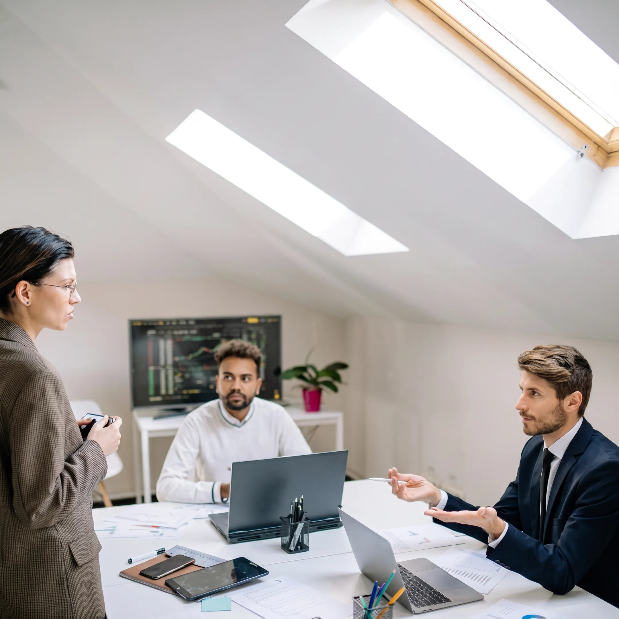 Business team using VoIP phones in an office