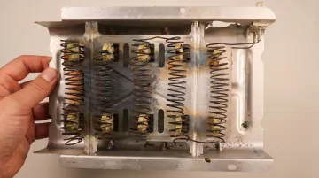 Dryer heating element and internal components showing wear from restricted airflow damage