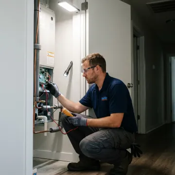 Technician checking HVAC air handler