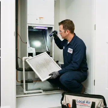 HVAC technician servicing an indoor air quality system