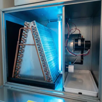 Glowing UV light installed inside air conditioning system