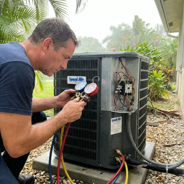 Technician inspecting an air conditioning system