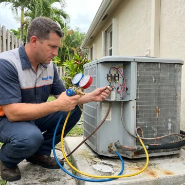 HVAC technician inspecting an air conditioning system