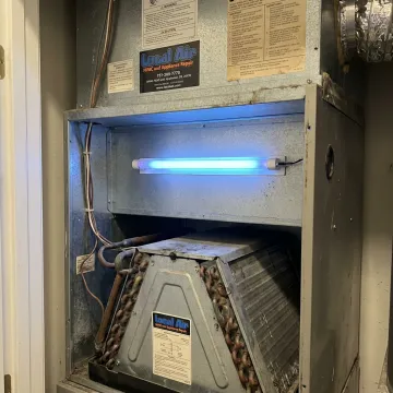 HVAC air purification system being serviced