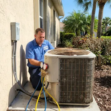 Technician repairing a residential air conditioning unit