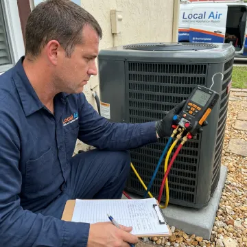 HVAC technician testing central AC system