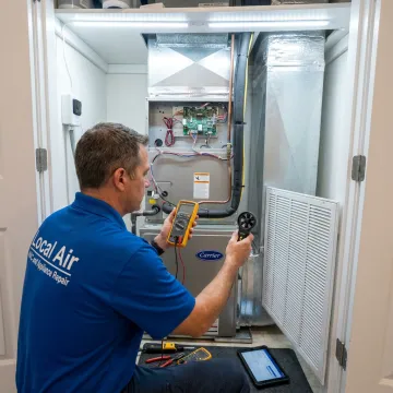 Technician checking AC performance