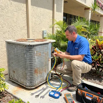 HVAC technician testing commercial AC equipment