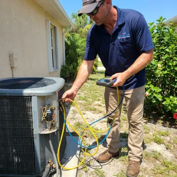 HVAC technician checking AC performance