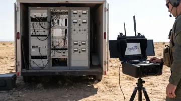 Lumistar portable ground station unit next to legacy rack telemetry equipment for size comparison