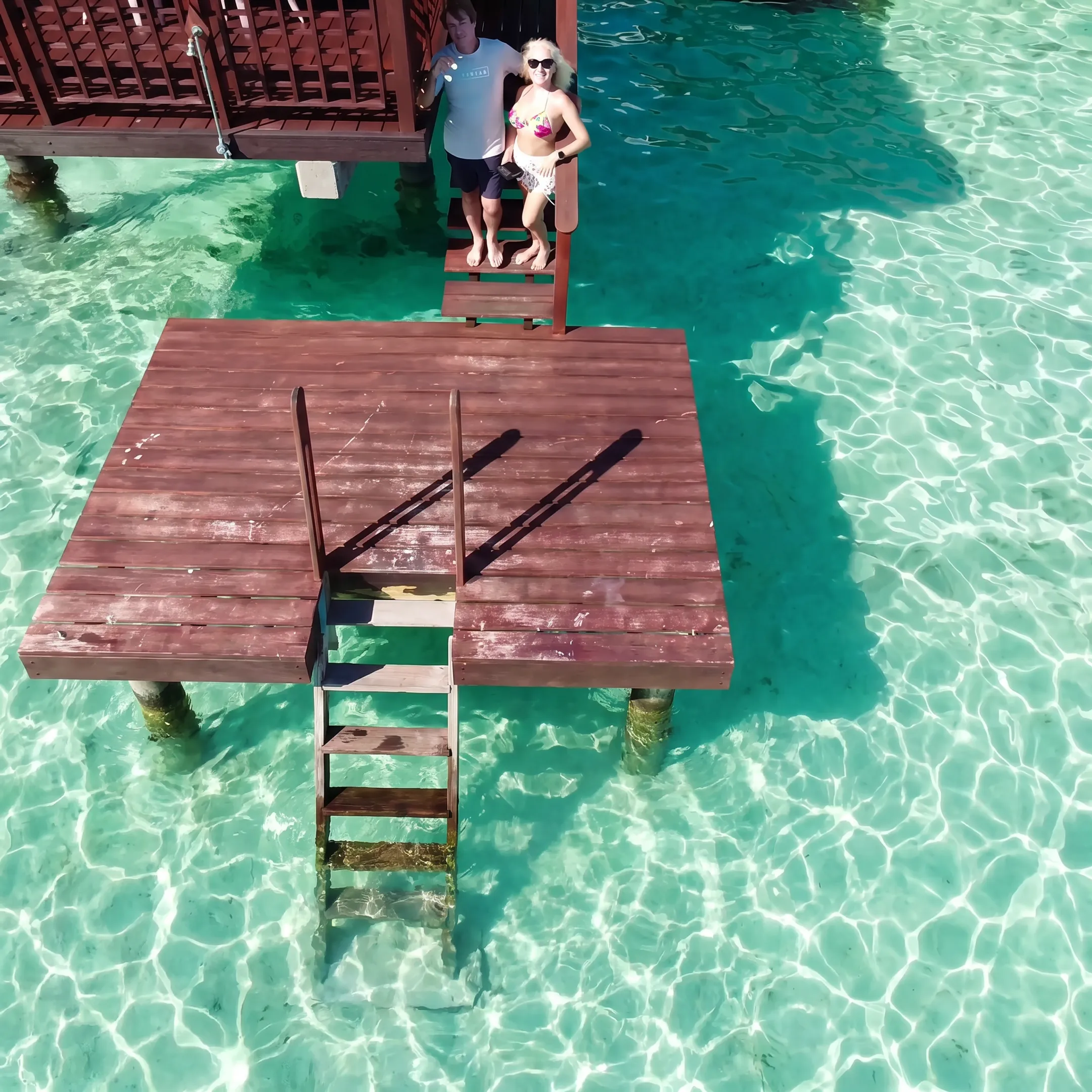 Travel advisor reviewing Bora Bora resort options with a couple