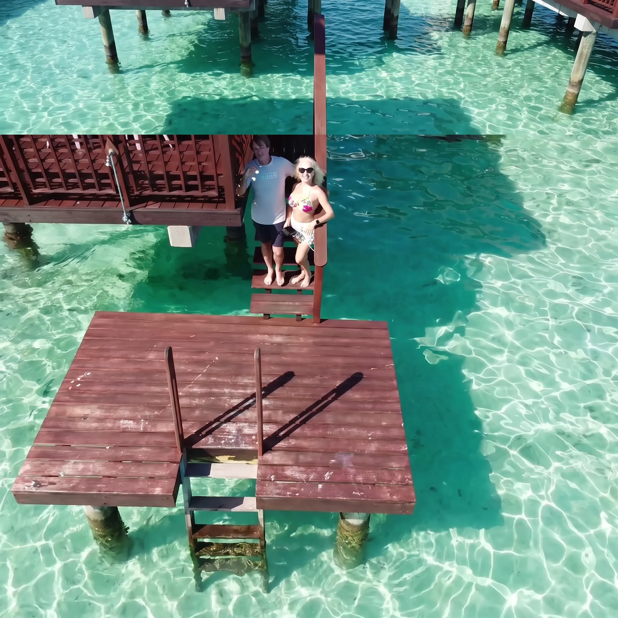 Honeymoon couple overlooking Bora Bora lagoon from an overwater villa