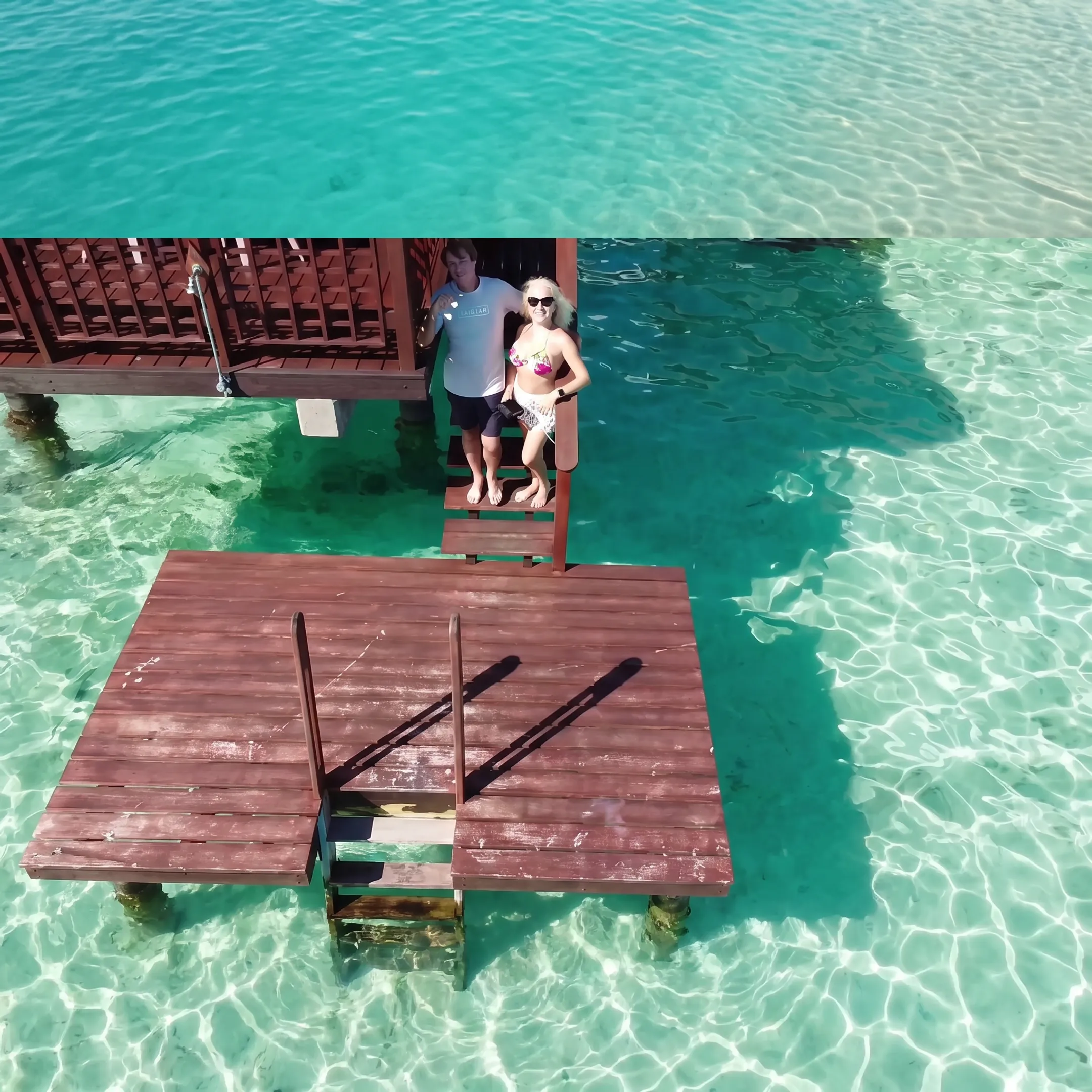 Travel advisor comparing Tahiti resort options with a client