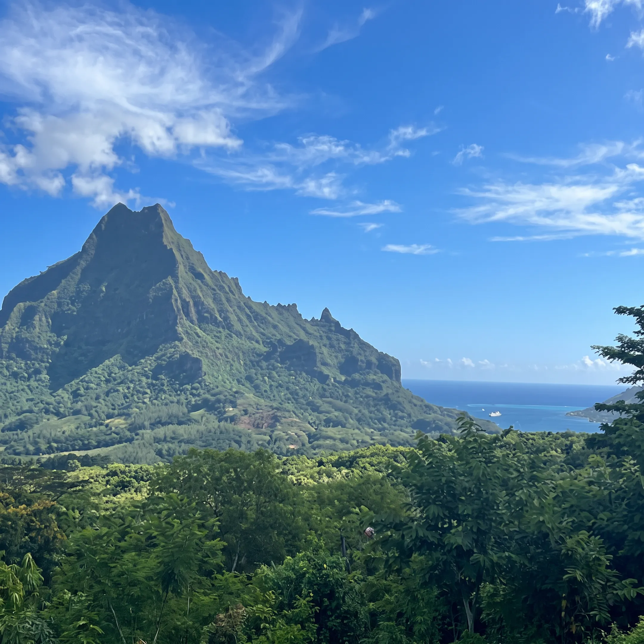 Luxury sailing cruise moving through a turquoise lagoon near French Polynesian islands