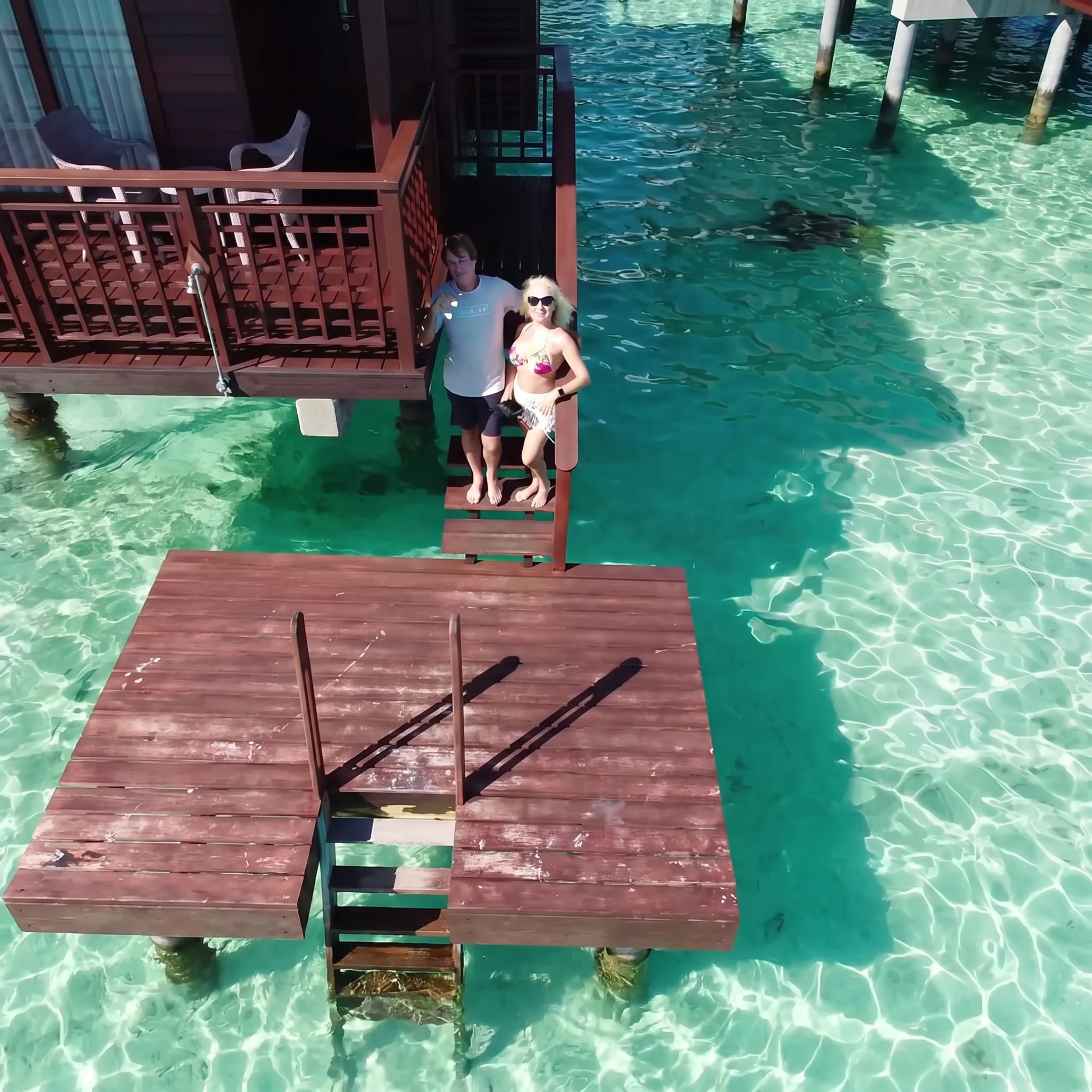 Travel advisor reviewing Bora Bora resort options and overwater villa details with a couple