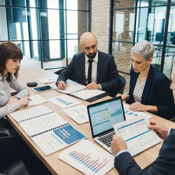 Business advisors reviewing valuation documents