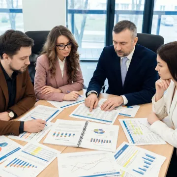 Consultants reviewing business valuation documents