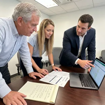Family business owners meeting with succession planning advisor