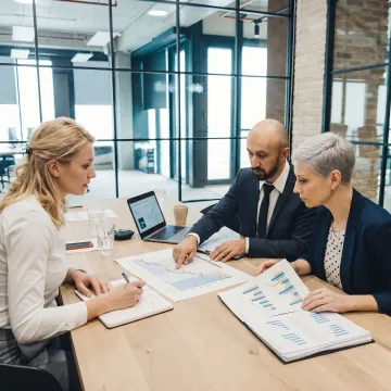 Consultants reviewing business strategy with owners