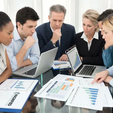 Consultants reviewing business strategy with executives