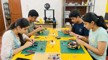 Students prototyping real-world solutions during hands-on innovation school program