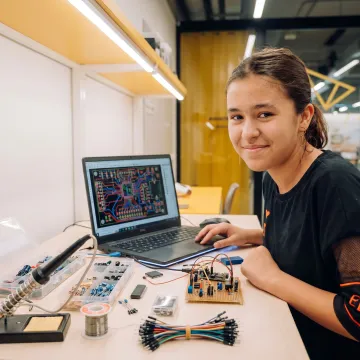 Learner working on a PCB design project