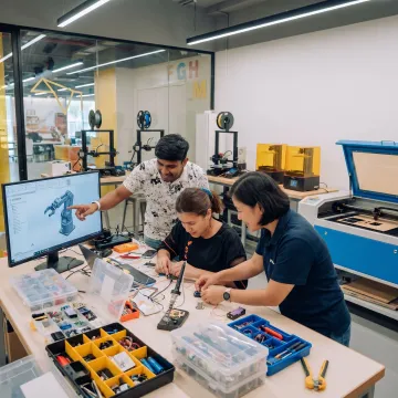 Engineering students building prototypes in a makerspace