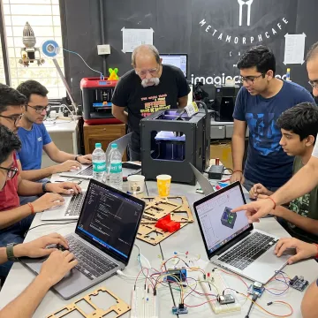 Students building prototypes in a digital fabrication course