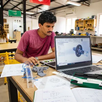 Student learning CAD design on a computer